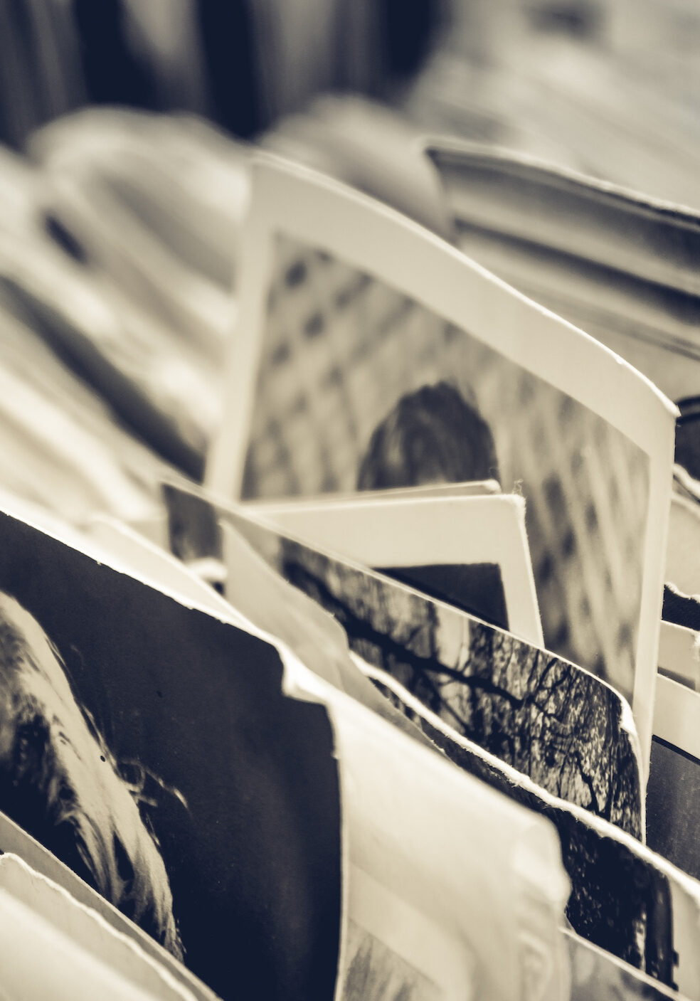 Collection of old black and white and sepia photos and postcards